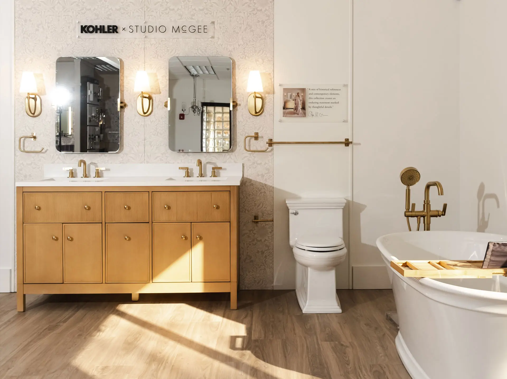 Sample bathroom with toilet and wood vanity in the Facets Wilmington NC Showroom